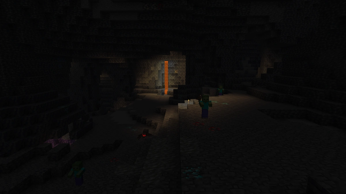 Minecraft cave without Fullbright. Most of the cave is pitch black and only a zombie near the lava is barely visible.